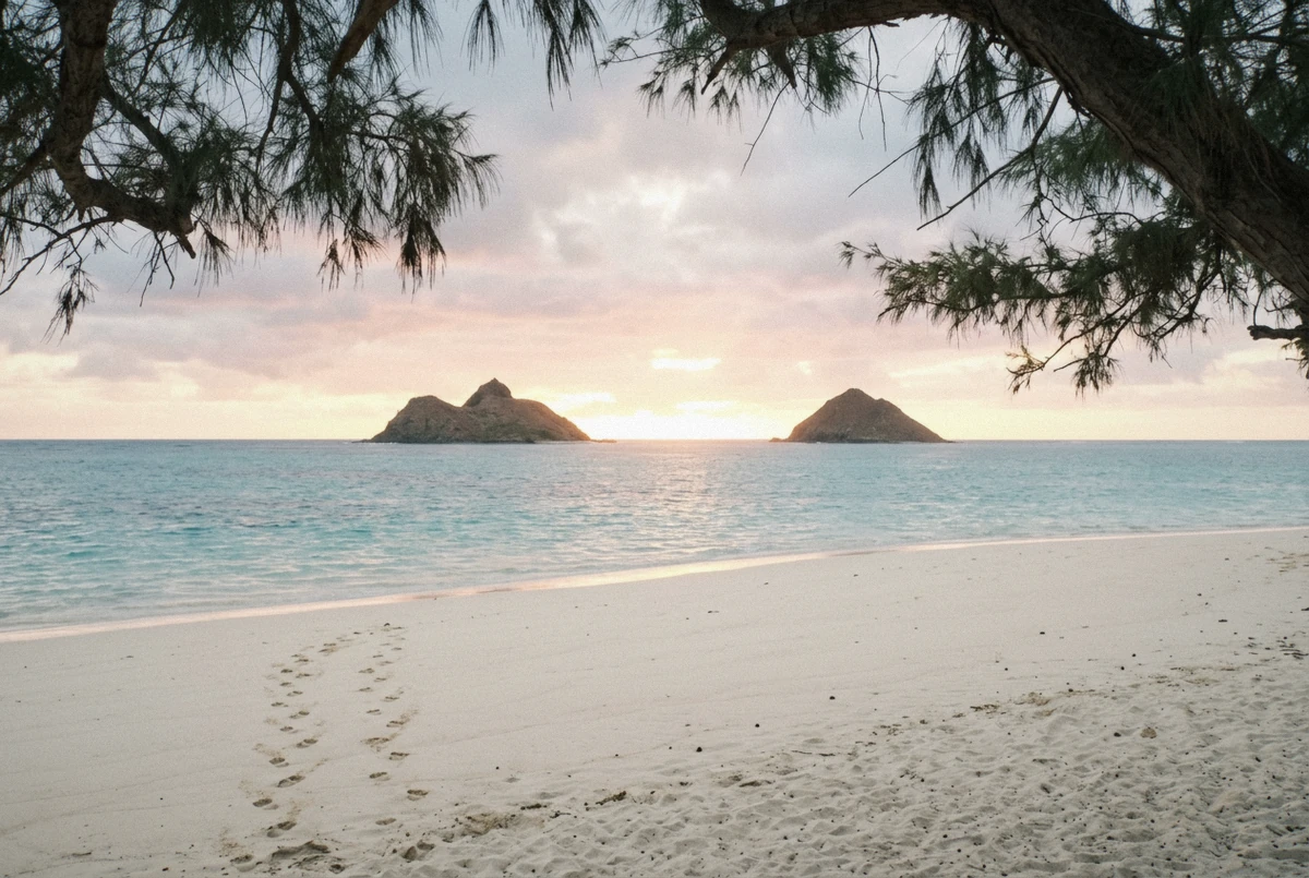 Sunrise over the Mokulua islands from Lanikai Beach on Oahu, a windward-coast Hawaii photoshoot location