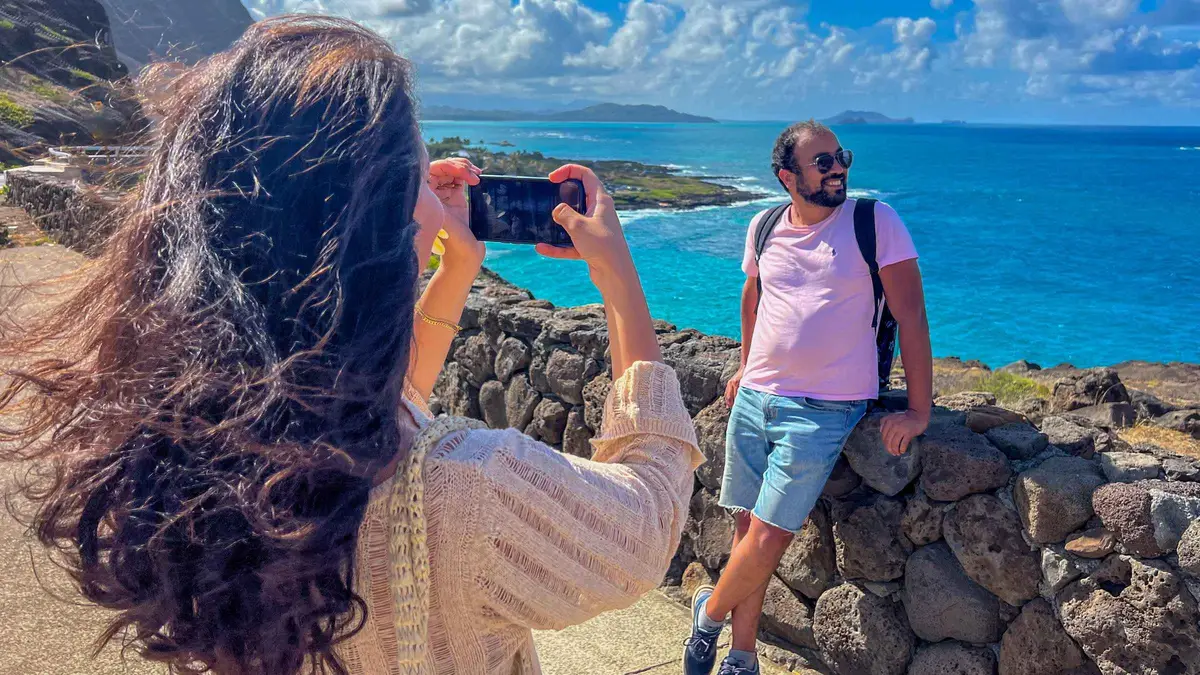 Travelers photographing the Halona Blowhole coastline on the Best of Oahu photo tour, a guided Hawaii photoshoot outing on the island's southeast shore